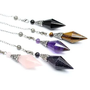 Detail view of hexagonal crystal dowsing pendulums in various natural stones.