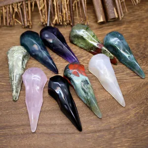 Close-up view of various hand-carved natural crystal bird skulls for Halloween decoration