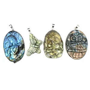 Hand-carved natural labradorite pendants featuring mermaid, butterfly, and owl designs.