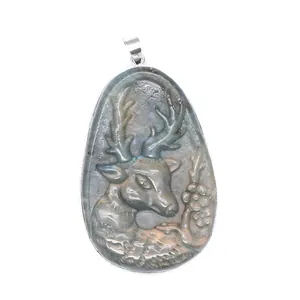 Close-up of natural labradorite pendant with intricately carved deer and floral details.