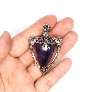 Macro view of medieval retro amethyst pendant necklace with intricate bronze details