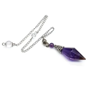 Detailed macro view of an amethyst hexagonal crystal point pendulum with silver chain