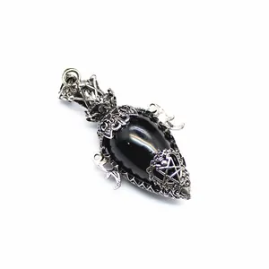 Detailed antique silver teardrop pendant featuring a black stone and gothic pentagram motif.