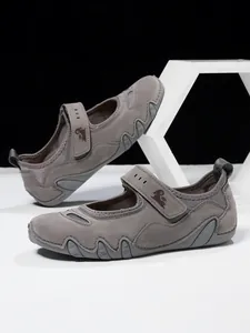 Detailed view of grey Mary Jane walking sneakers featuring velcro straps and breathable mesh