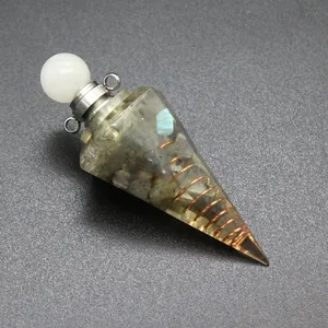 Macro detail of hexagonal resin cone pendant with tourmaline stones and copper coil