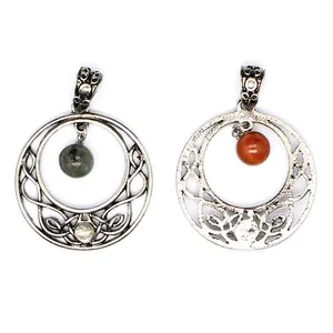 Detailed view of hollow moon pendants with intricate Celtic knotwork and natural stones