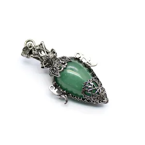 Antique silver egg-shaped green crystal pendulum pendant with ornate metalwork