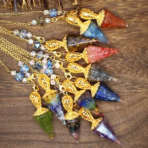 Collection of hexagonal cone crystal pendulums with resin-encased crushed stones