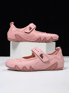 Side view of pink Mary Jane casual shoes with decorative velcro strap design