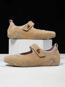 Detail view of khaki women's Mary Jane sport sandals featuring durable velcro straps