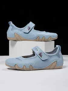 Side detail of light blue women's Mary Jane casual sneakers with mesh and wavy rubber sole