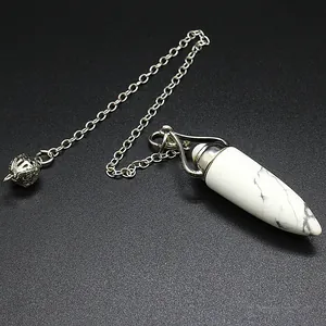 Close-up of white marble stone crystal pendulum with silver chain on black background