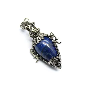 Detail of antique silver egg-shaped lapis lazuli pendulum pendant with pentagram design