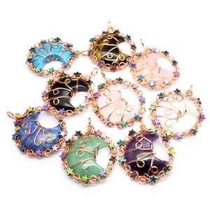 Detailed view of handmade wire-wrapped crystal moon pendants in assorted gemstones