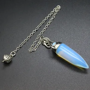 Detailed macro view of an opalite crystal bullet pendulum pendant with silver chain