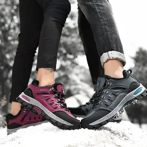 Unisex outdoor low-top hiking shoes for couples shown on snow ground in winter scene