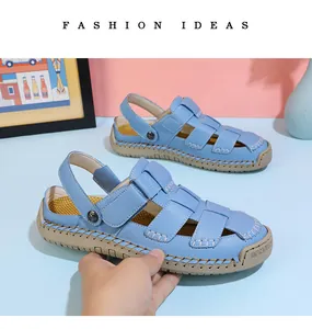 Close-up of light blue fisherman sandals for women featuring white stitching and strap