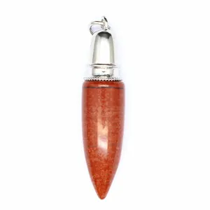 Detail of bullet-shaped pendant made of natural red jasper with silver metal cap