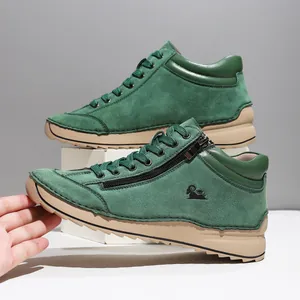 Close-up of green suede leisure shoes with side zipper and premium hand-stitched detail