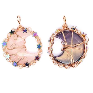 Detailed view of handmade wire wrapped moon pendants with colorful stars and crystals