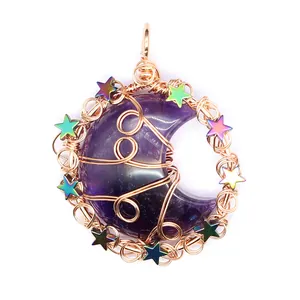 Detailed view of handmade wire-wrapped amethyst moon pendant featuring colorful stars
