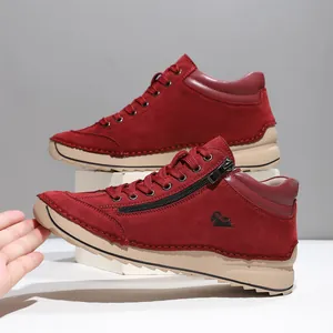 Detailed view of wine red hand-stitched women shoes with side zipper and soft sole