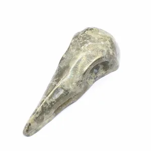 Close-up detail of natural white moonstone bird skull carving decoration