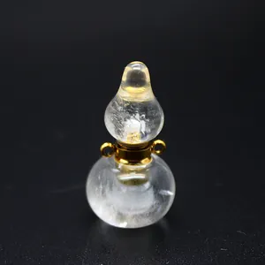 Clear crystal gourd-shaped perfume bottle pendant with gold metal accents.
