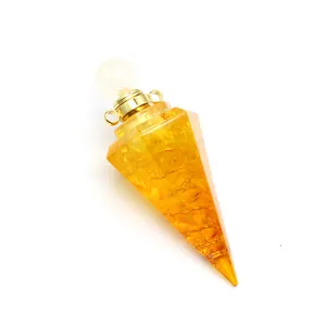 Hexagonal pyramid resin pendant with yellow tourmaline stones and gold cap