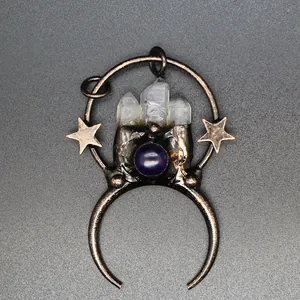 Detailed macro view of vintage moon and star pendant with raw white crystal and purple stone