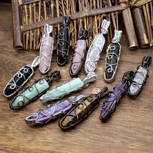 Detailed view of assorted natural hexagonal crystal pendants with hand wire-wrapped design