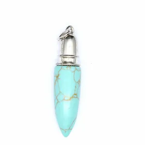 Detailed view of a turquoise natural stone bullet pendant with a silver metallic cap