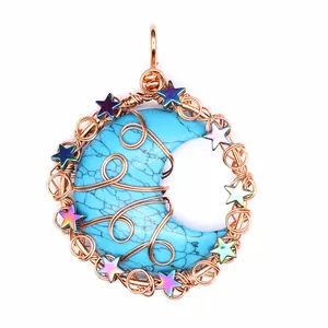 Close-up detail of hand-woven copper wire-wrapped blue moon pendant with stars