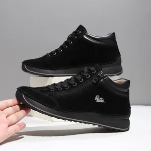 Detailed side view of hand-stitched black suede casual women's shoes with zippers