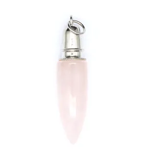 Macro detail shot of a polished pink rose quartz bullet pendant with a silver metal cap