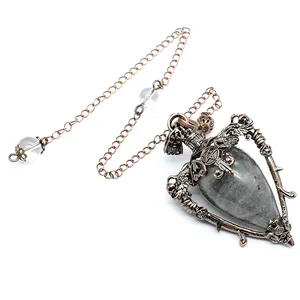 Close-up of retro medieval style natural stone bottle pendant with pentagram details