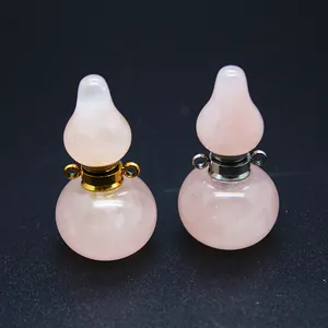 Pair of rose quartz gourd perfume bottle pendants with gold and silver accents.