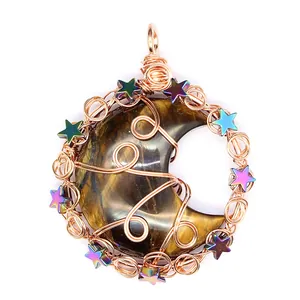 Detailed view of handmade tiger eye moon pendant with rose gold wire wrap
