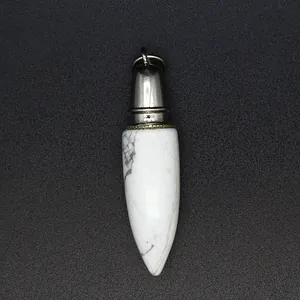 Close-up detail of a white marble texture bullet shaped natural stone pendant.
