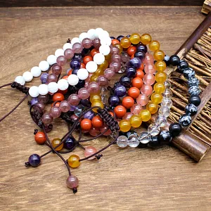 Variety of 8mm natural stone bead hand-woven bracelets with adjustable cord design.