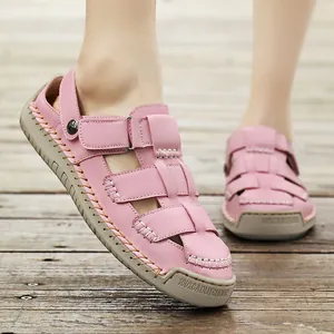 Fashionable pink caged leather sandals for women, 2025 summer casual comfort style.