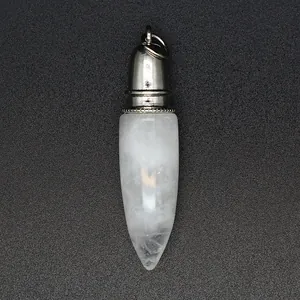 Detailed macro view of a white natural stone bullet-shaped pendant with silver metal cap
