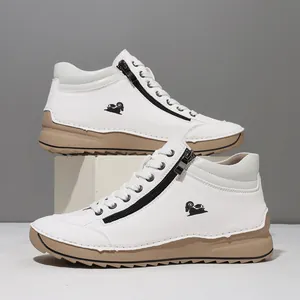 Detailed side view of white hand-stitched casual high-top sneakers with functional zipper