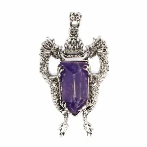 Close-up of antique silver double dragon shield pendant featuring a purple crystal stone