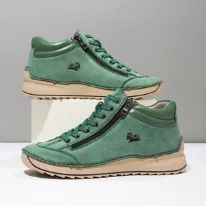 Side view of green handmade stitched women's casual shoes with soft sole and zipper