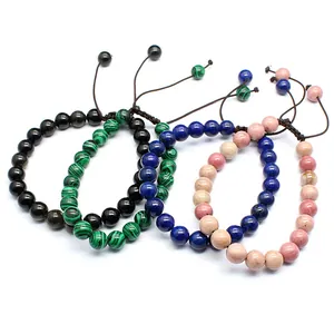 Close-up detail of four handmade 8mm natural stone bead woven bracelets
