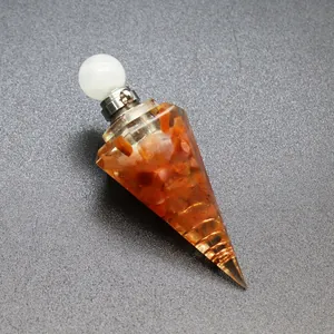 Detail shot of hexagonal cone resin pendant with tourmaline stones and copper coil.
