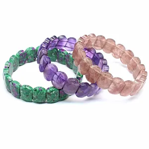Close-up of faceted natural crystal bracelets showing unique stone textures and colors.