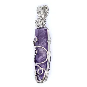 Handmade wire wrapped purple crystal hexagonal pillar pendant close-up view