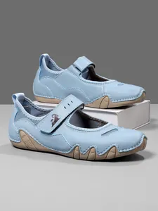 Side view of light blue Mary Jane casual shoes with sporty non-slip rubber soles.